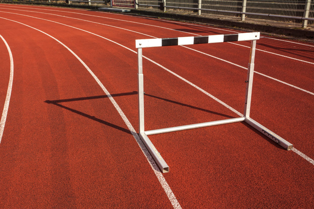 Hurdle on a track to represent overcoming obstacles.