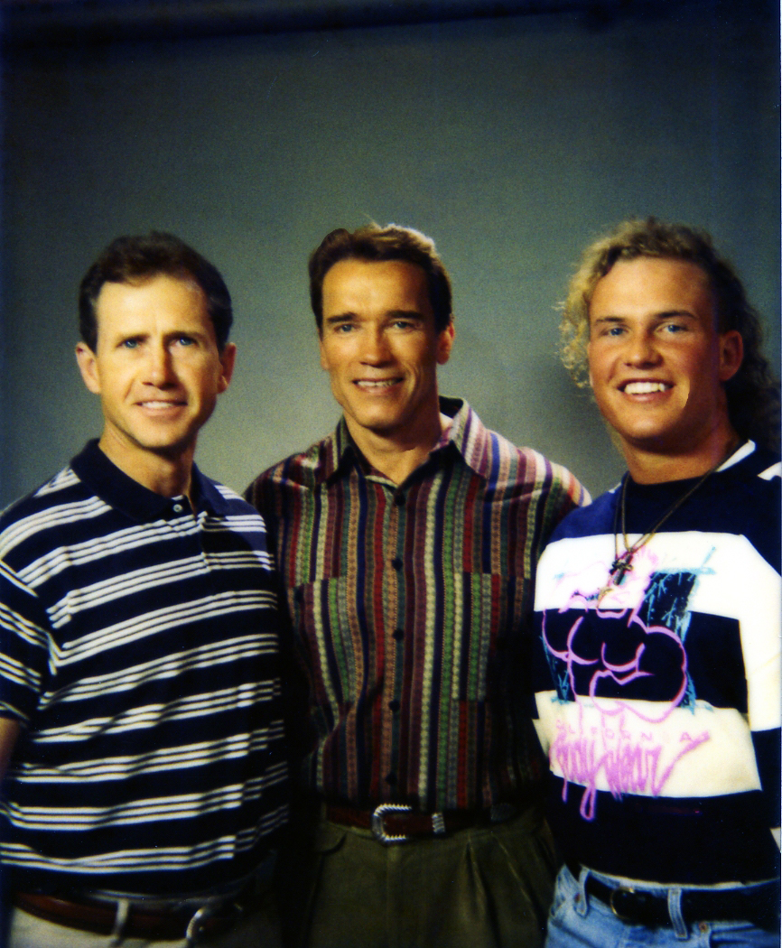 Larry and son Adam with celebrity, Arnold Schwarzenegger.