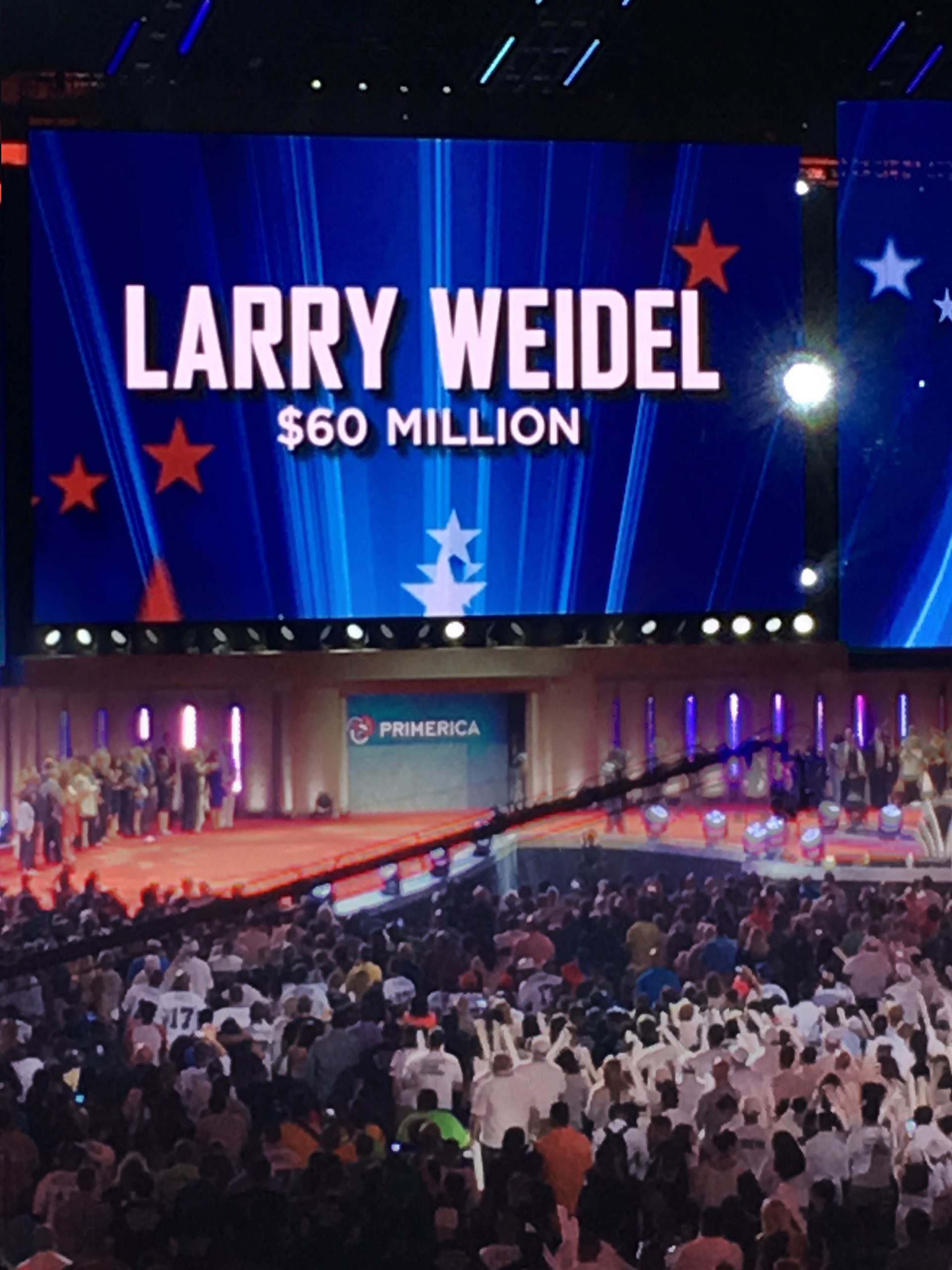 Larry accepting award in front of 40,000+ at convention.